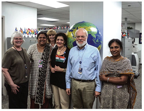 Fig B:  Dr. Kala Ebenezer, at left, of Christian Medical College Hospital in Vellore, India, visits the team at Cincinnati Children’s Division of Global Child Health. Mark Steinhoff, MD, the division’s Director, is second from the right. The study on the correlation between vitamin D status and PICU outcomes was conducted at CMC Hospital.